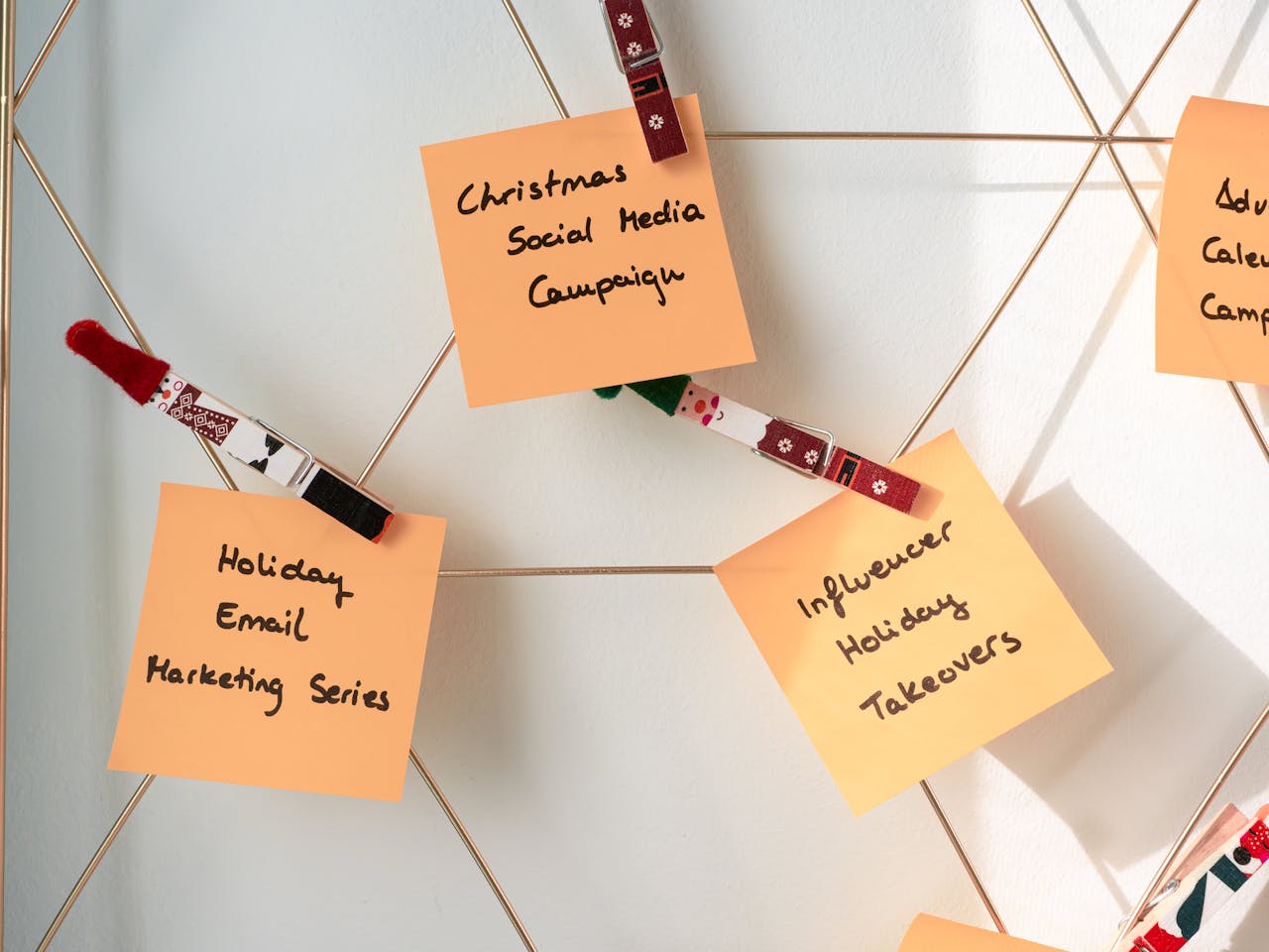 team-04 Sticky notes with holiday marketing ideas for Christmas social media and email campaigns.